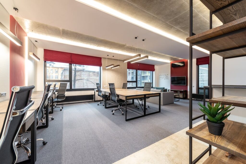 pexels-photo-6899395 Office with tables and chairs near windows